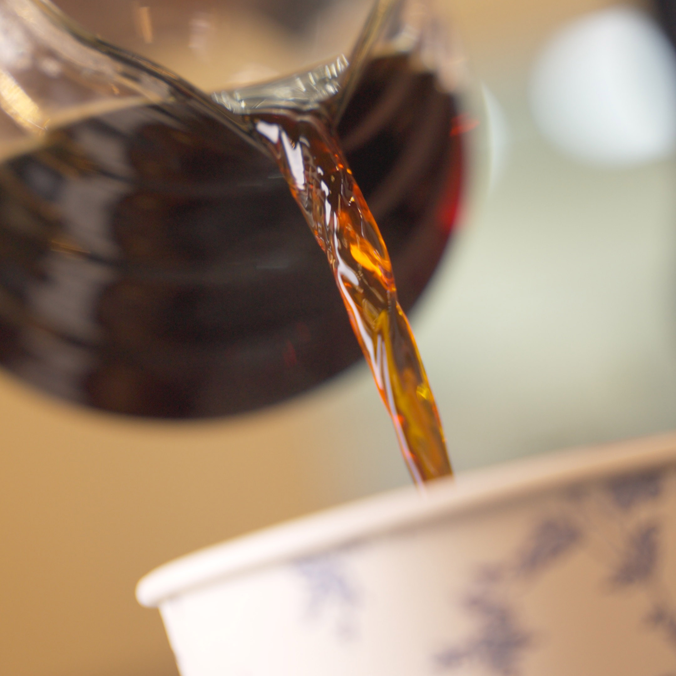 Coffee poured into a Monaco's Cafe takeaway cup