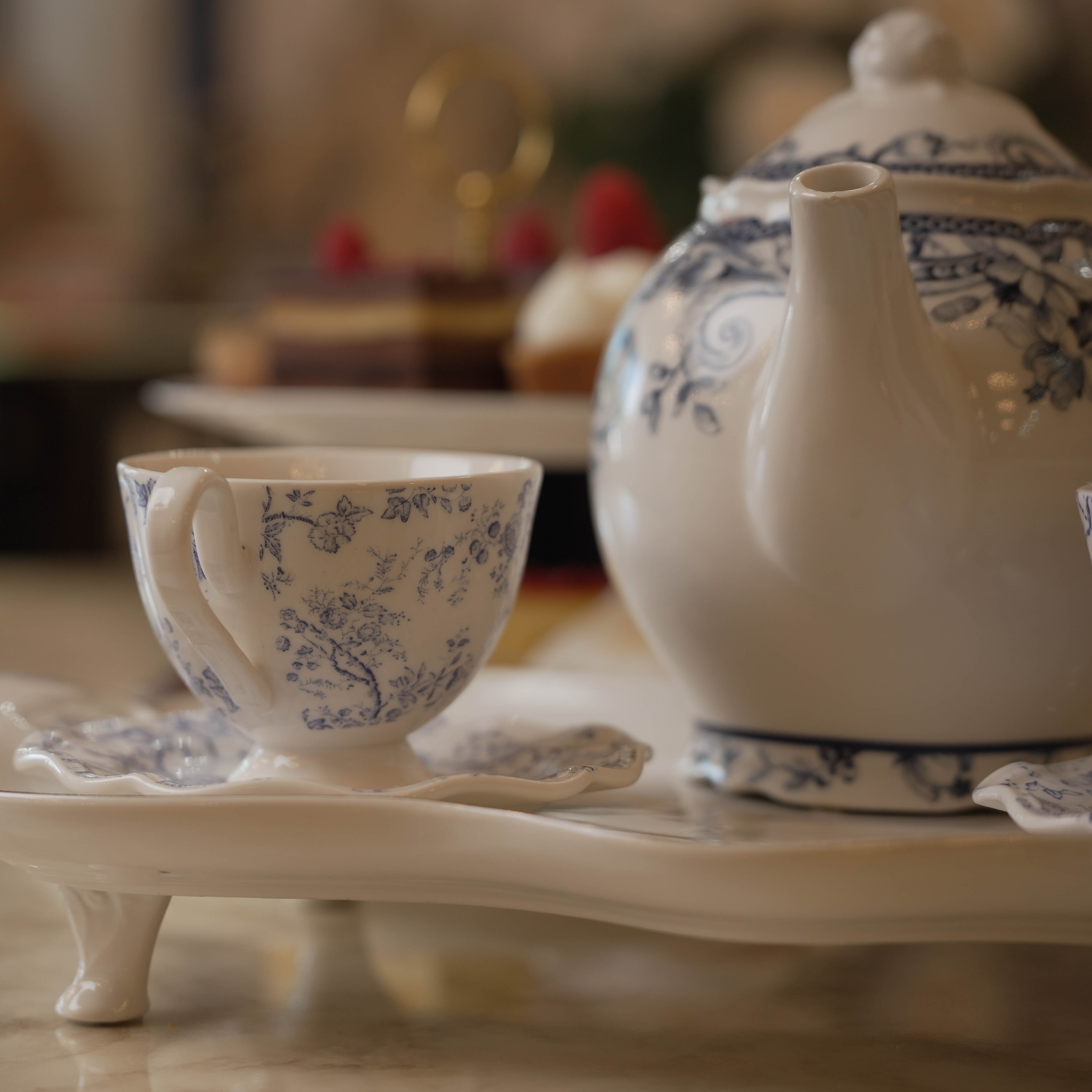 Tea set with teapot and cup at Monaco's Cafe